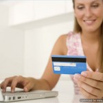 woman with laptop and credit card