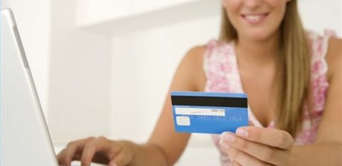 woman with laptop and credit card