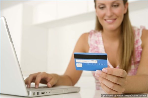 woman with laptop and credit card