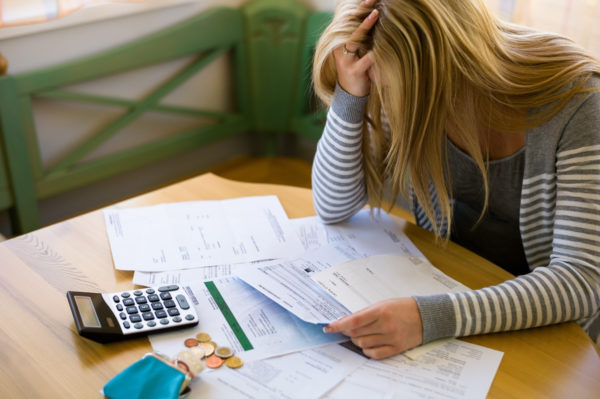 frustrated woman figuring out her budget