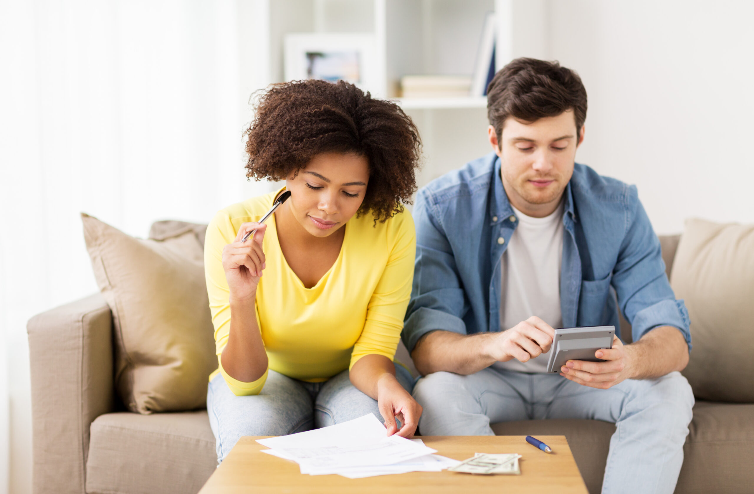 Couple researching DIY debt consolidation