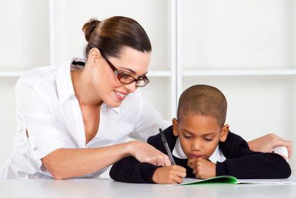 Woman tutoring small boy to earn extra money to pay off debt