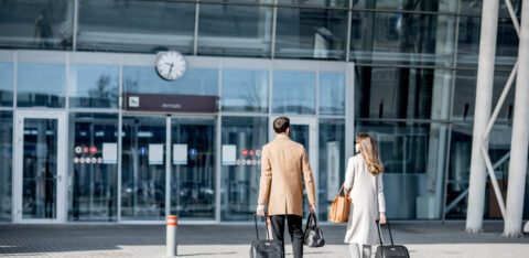 Business couple walking to the airport