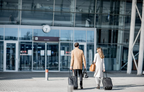 Business couple walking to the airport