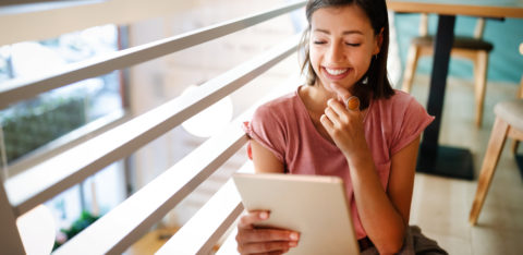 young woman making a budget to pay off debt