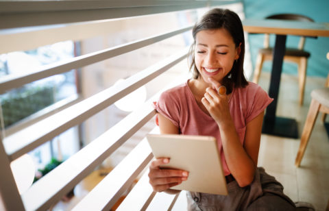 young woman making a budget to pay off debt