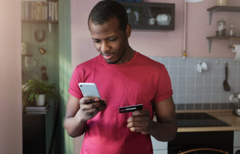 man using credit card responsibly