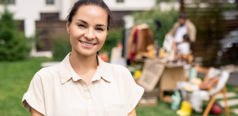 smiling woman who is debt-free