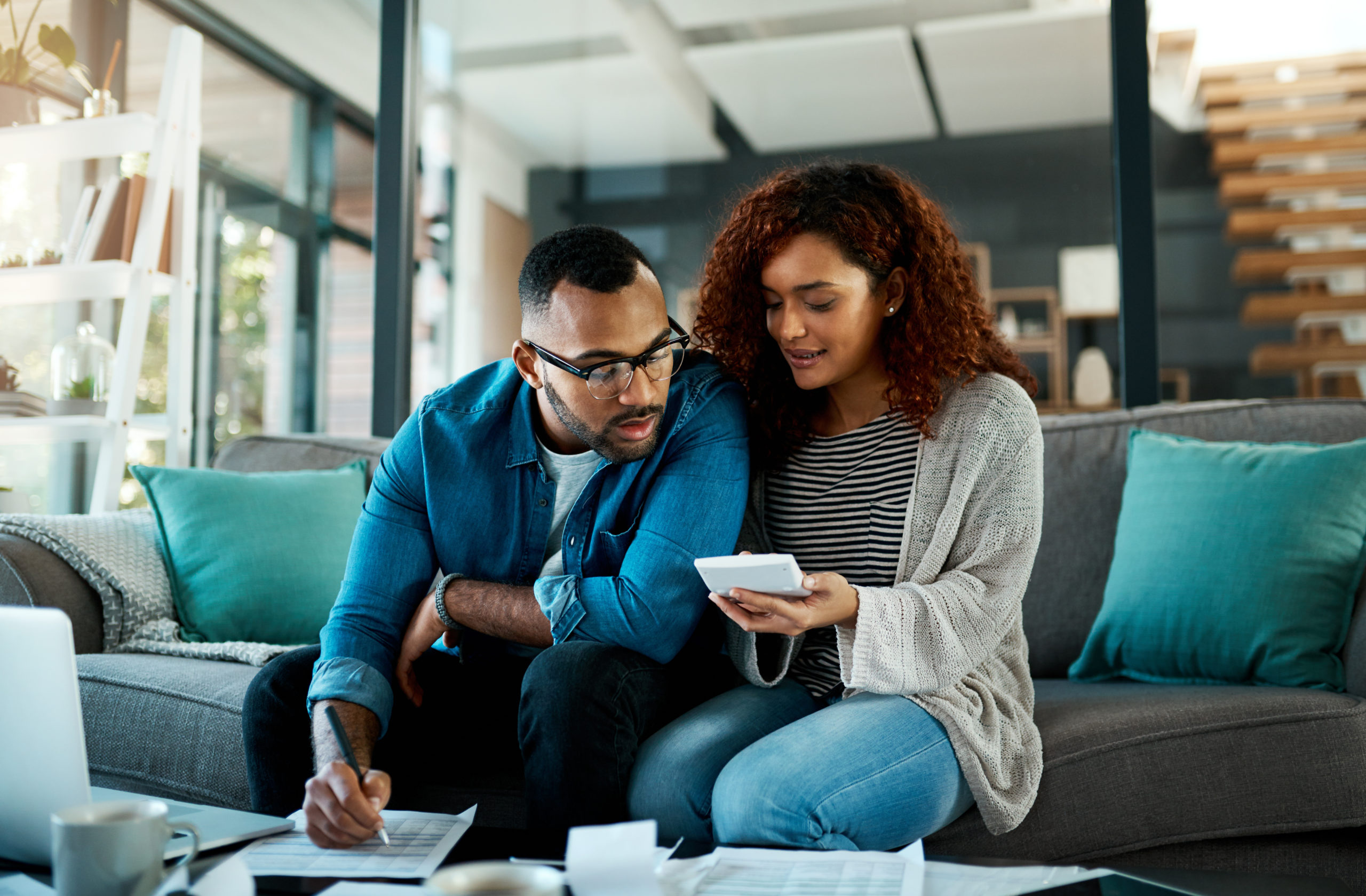 a young couple discussing credit card debt management