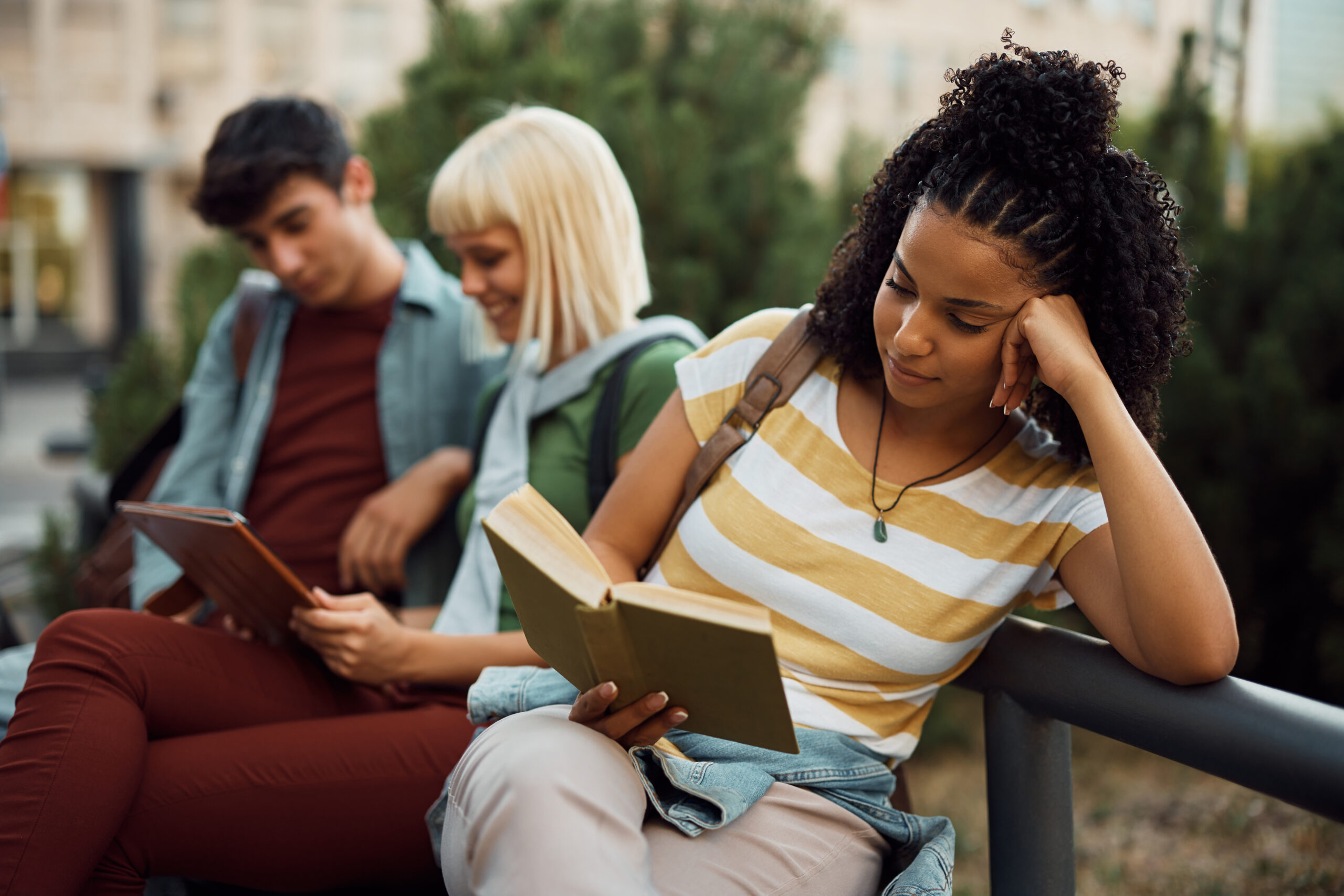 young woman reading a money management book