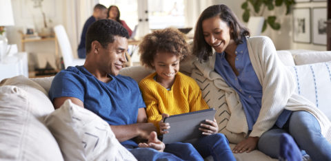 parents discussing credit management with their teenage daughter