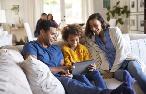 parents discussing credit management with their teenage daughter