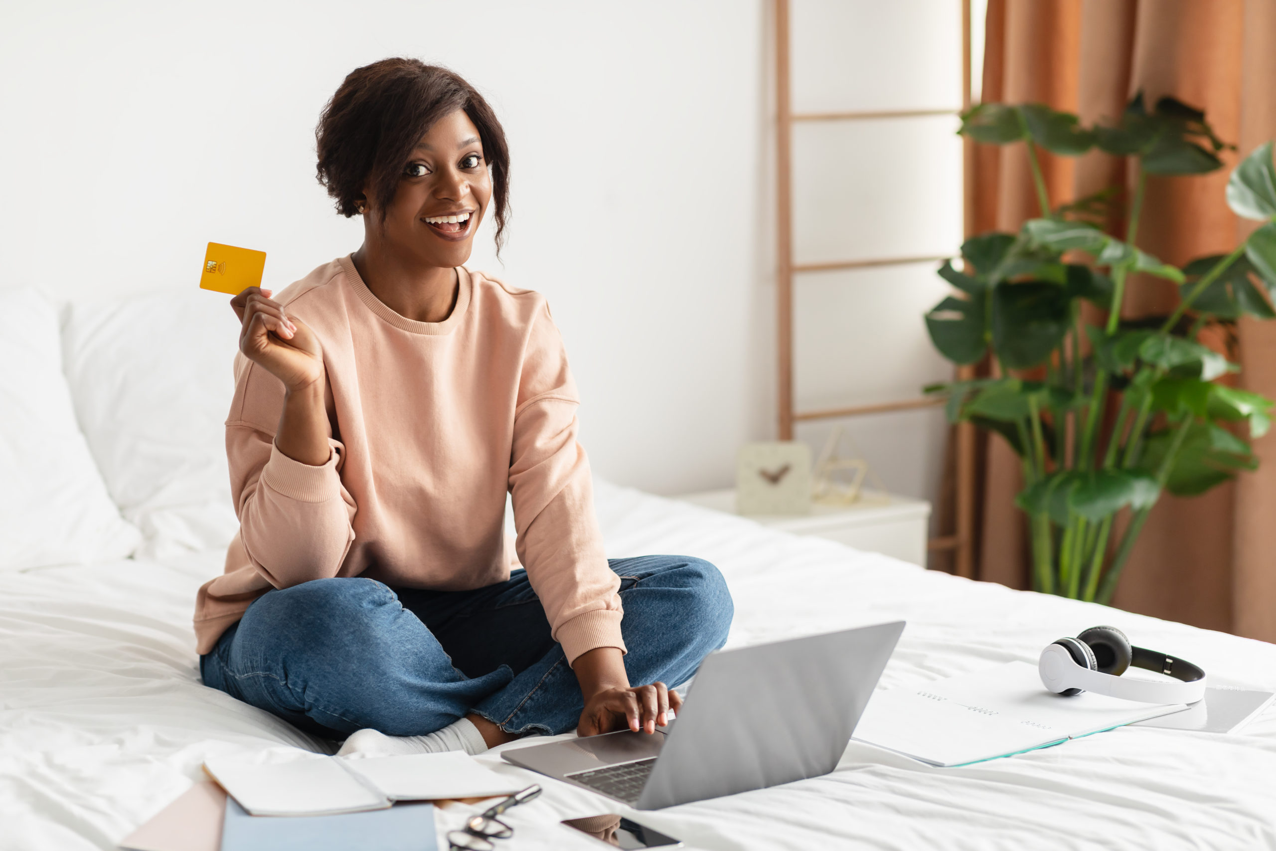 woman on her laptop managing credit cards