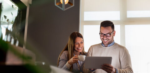 Couple using tablet computer