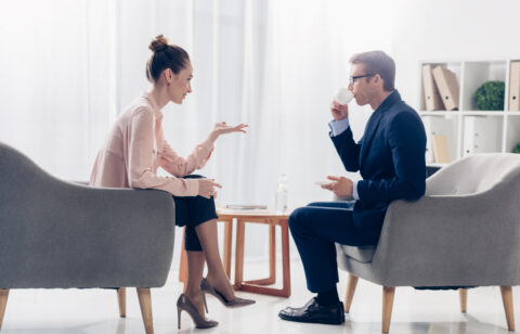 man and woman discussing financial advice