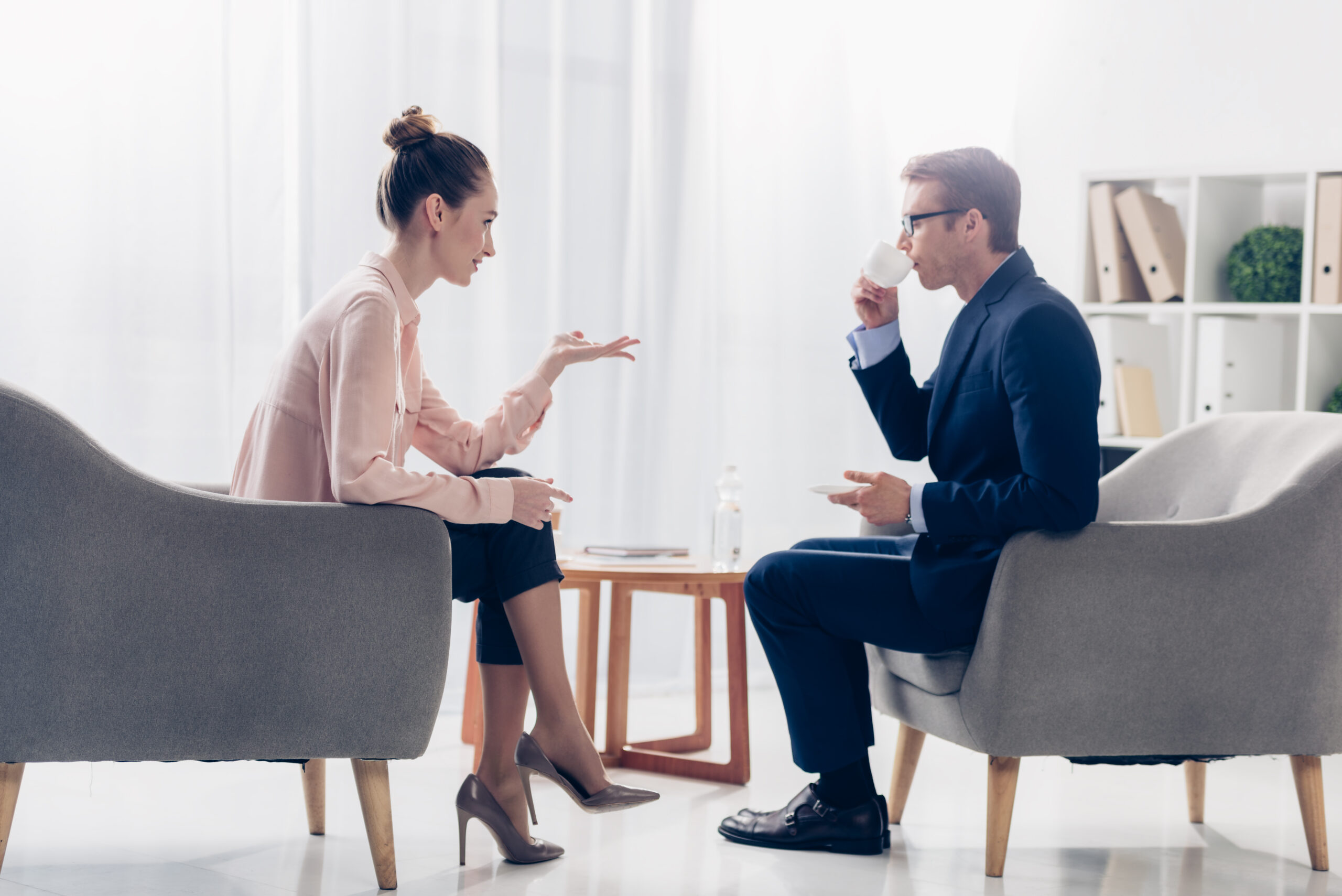 man and woman discussing financial advice