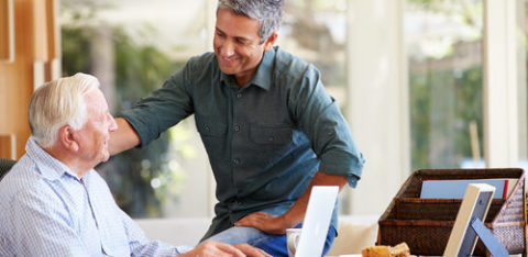 two men talking in an office