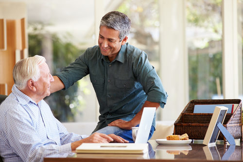 two men talking in an office