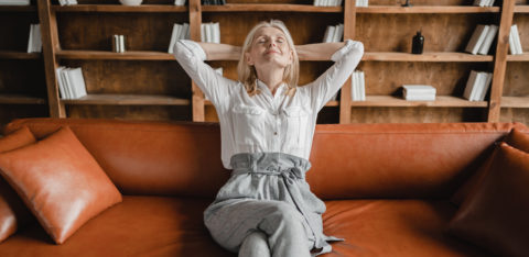 woman relaxing after reducing credit card debt