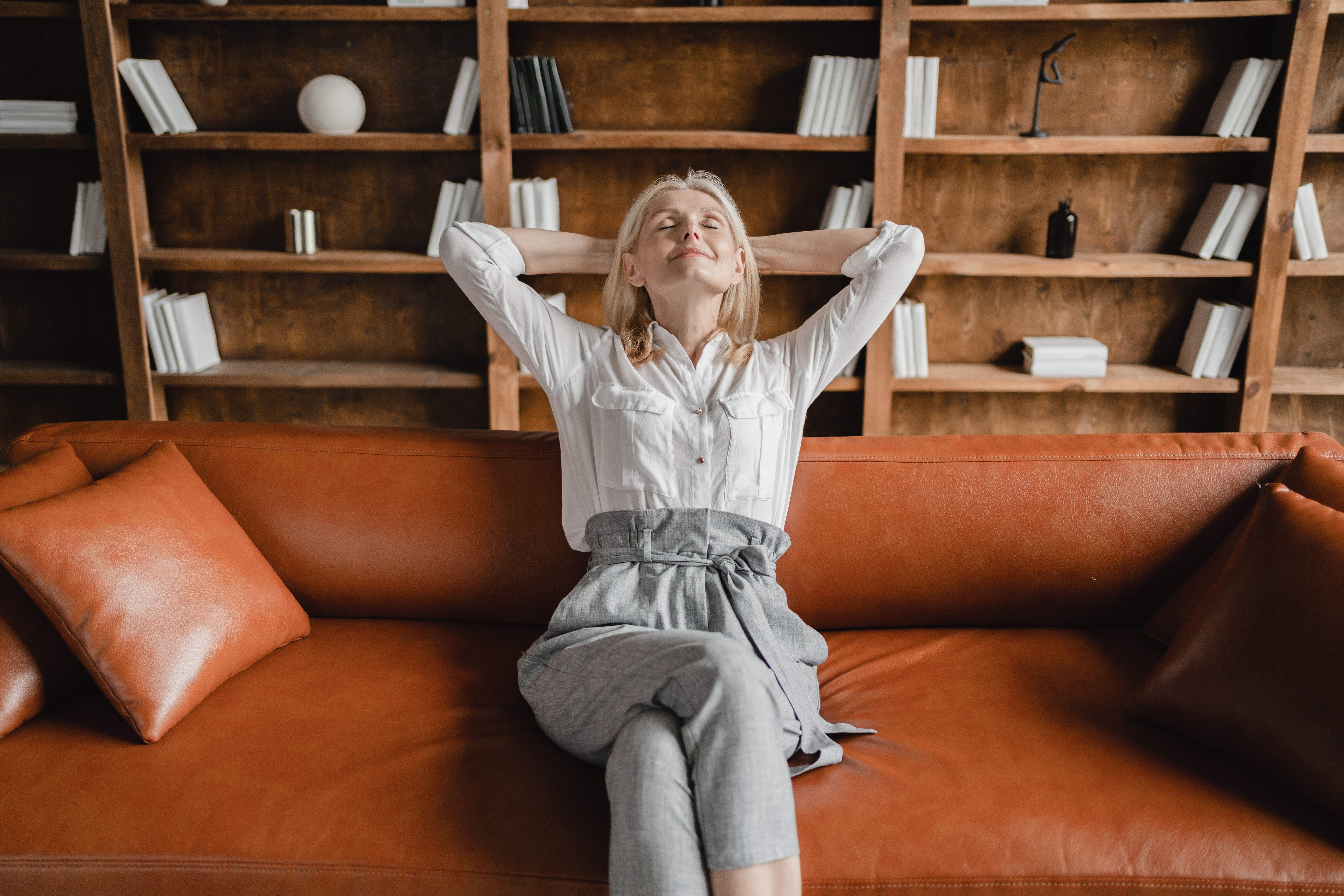 woman relaxing after reducing credit card debt