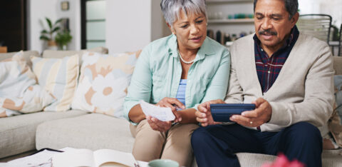 elderly couple managing money wisely