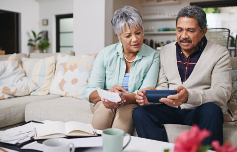 elderly couple managing money wisely