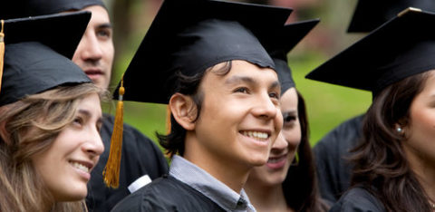 Young adults grduating with caps and gowns