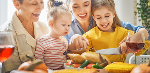 family cutting turkey