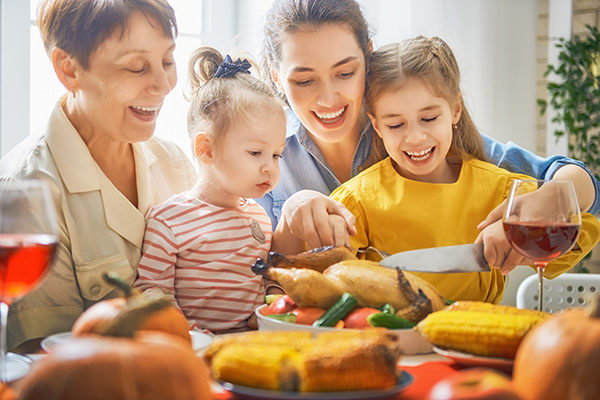 family cutting turkey