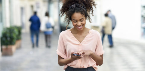 woman looking through free budgeting apps