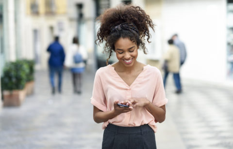 woman looking through free budgeting apps