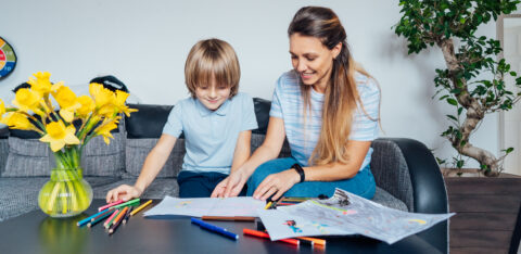 boy preparing a mother's day gift for mom