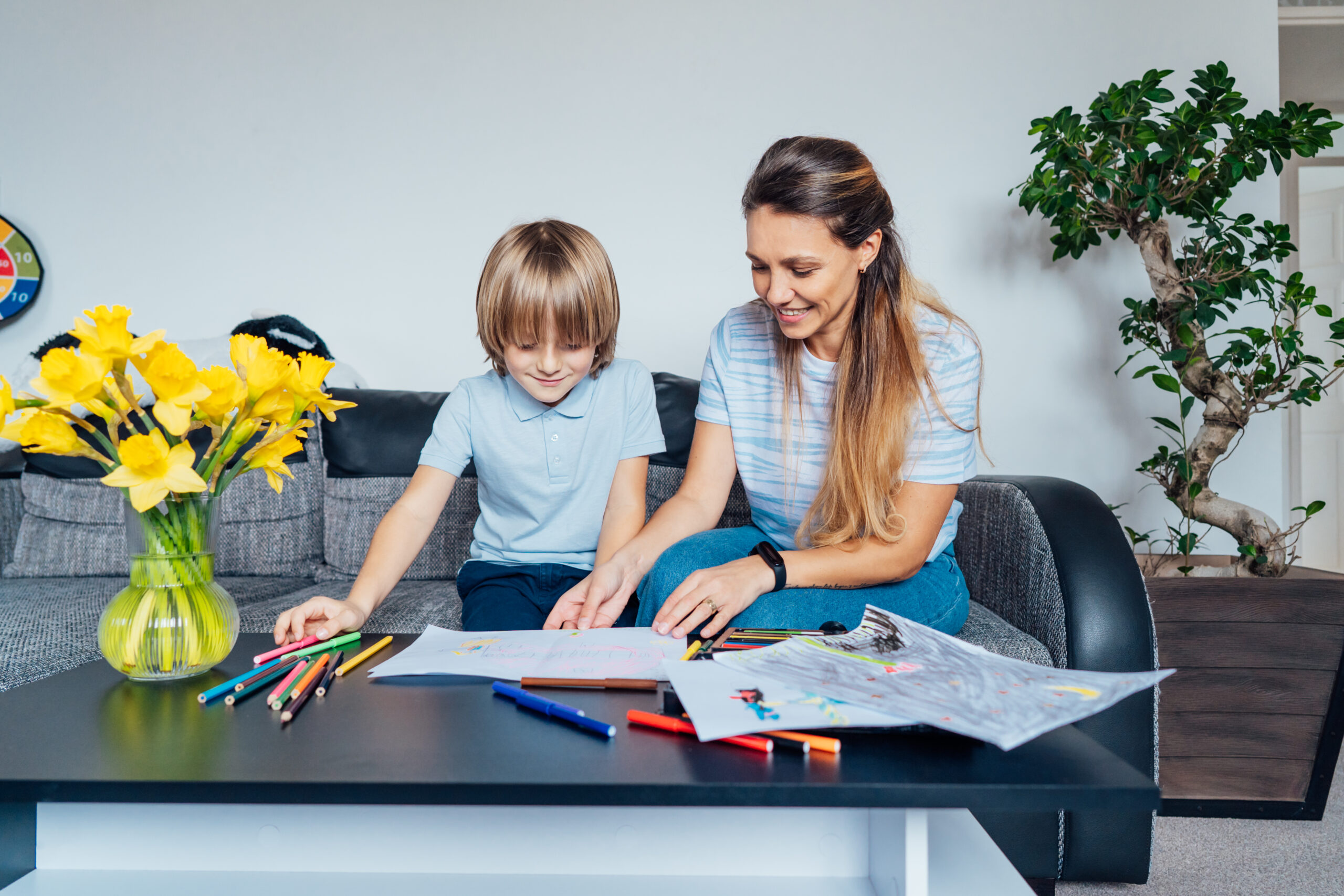 boy preparing a mother's day gift for mom