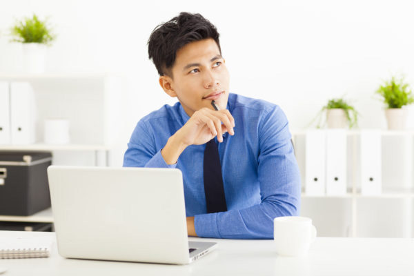 businessman thinking about the best way to deal with debt