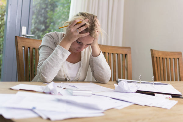 women frustrated in debt with bad credit