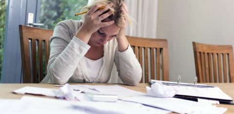 Woman looking at late payment