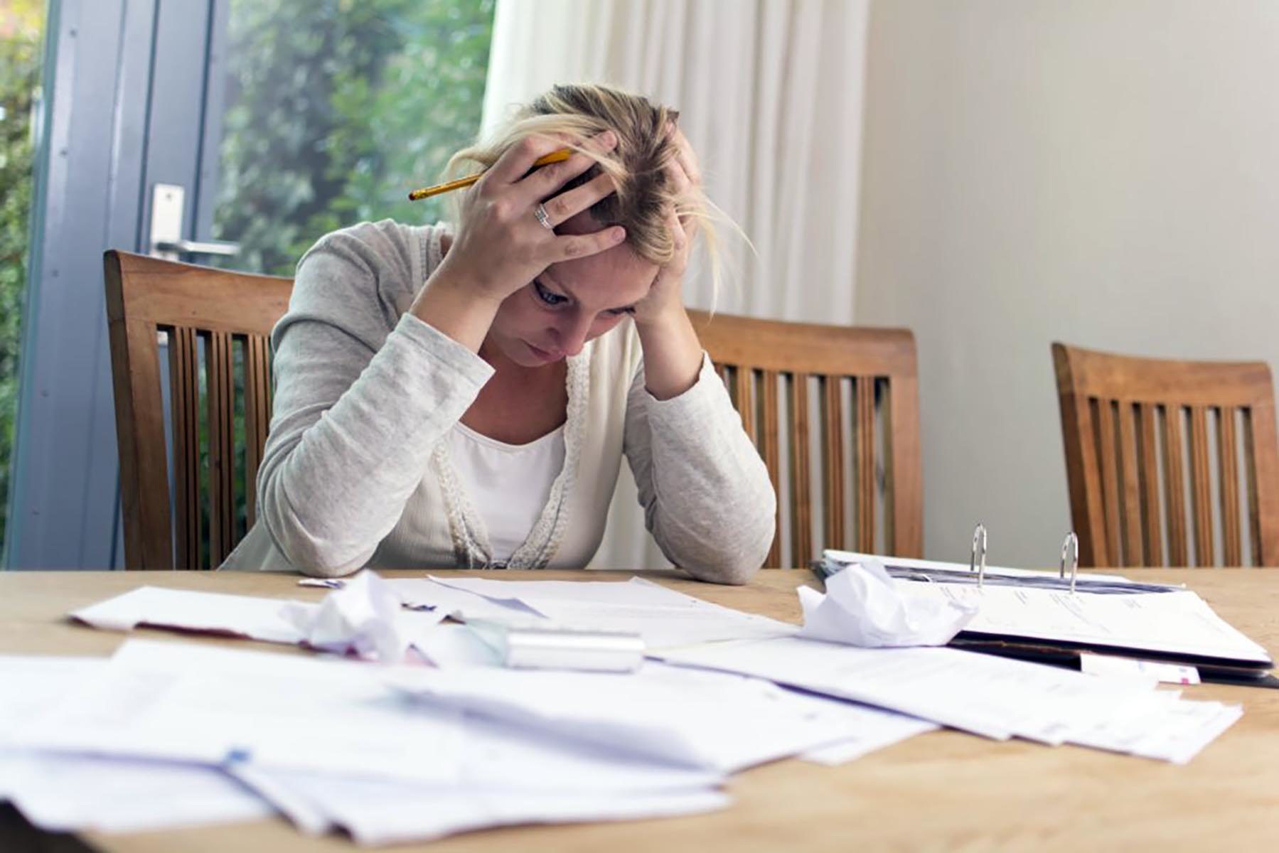 Woman looking at late payment