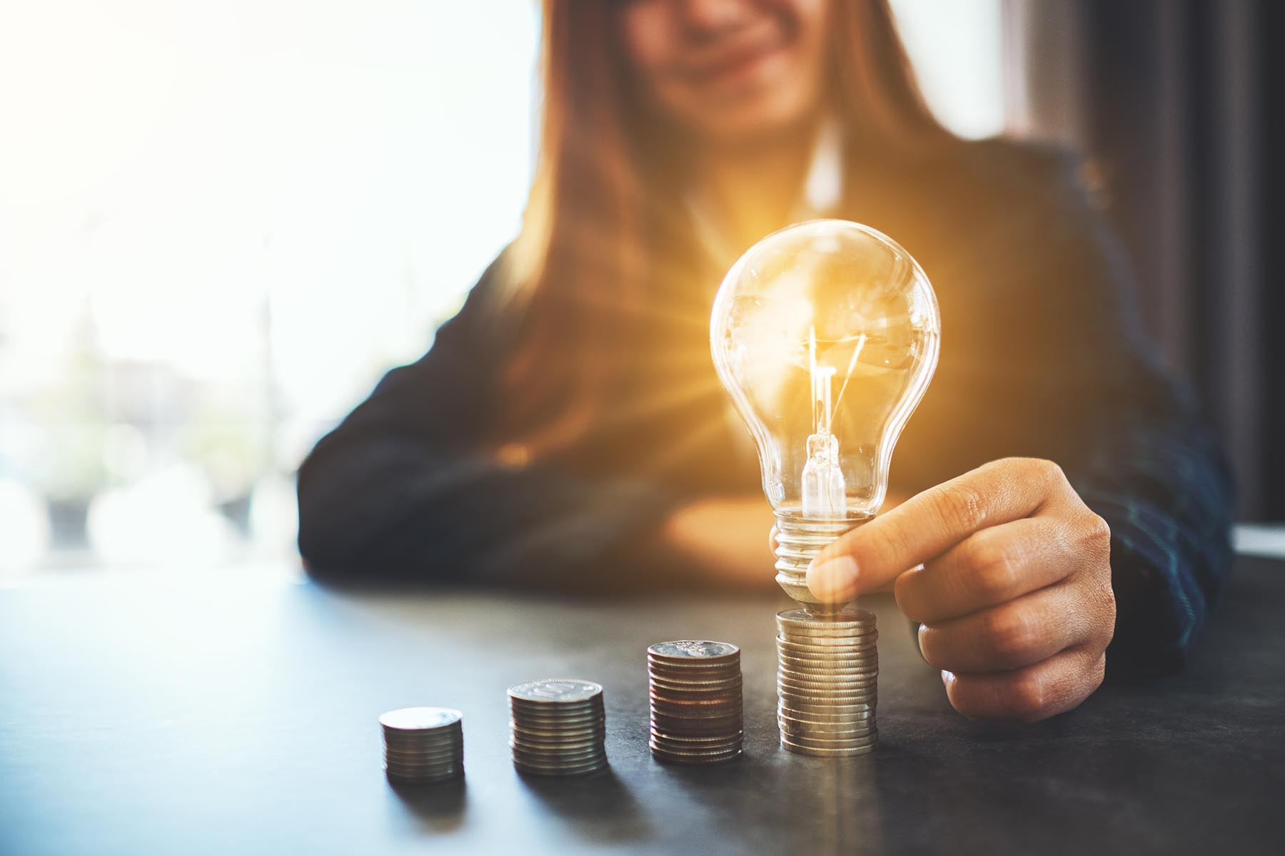 lightbulb and coins