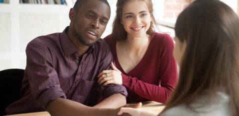 Couple learning about debt settlement companies