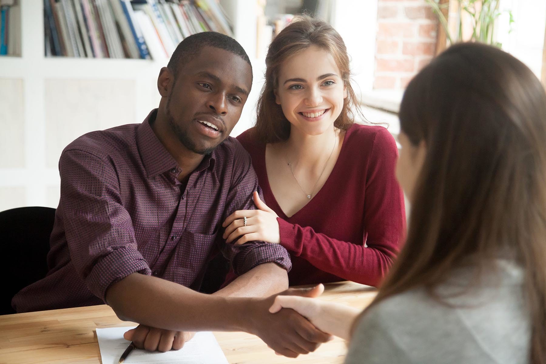 Couple learning about debt settlement companies