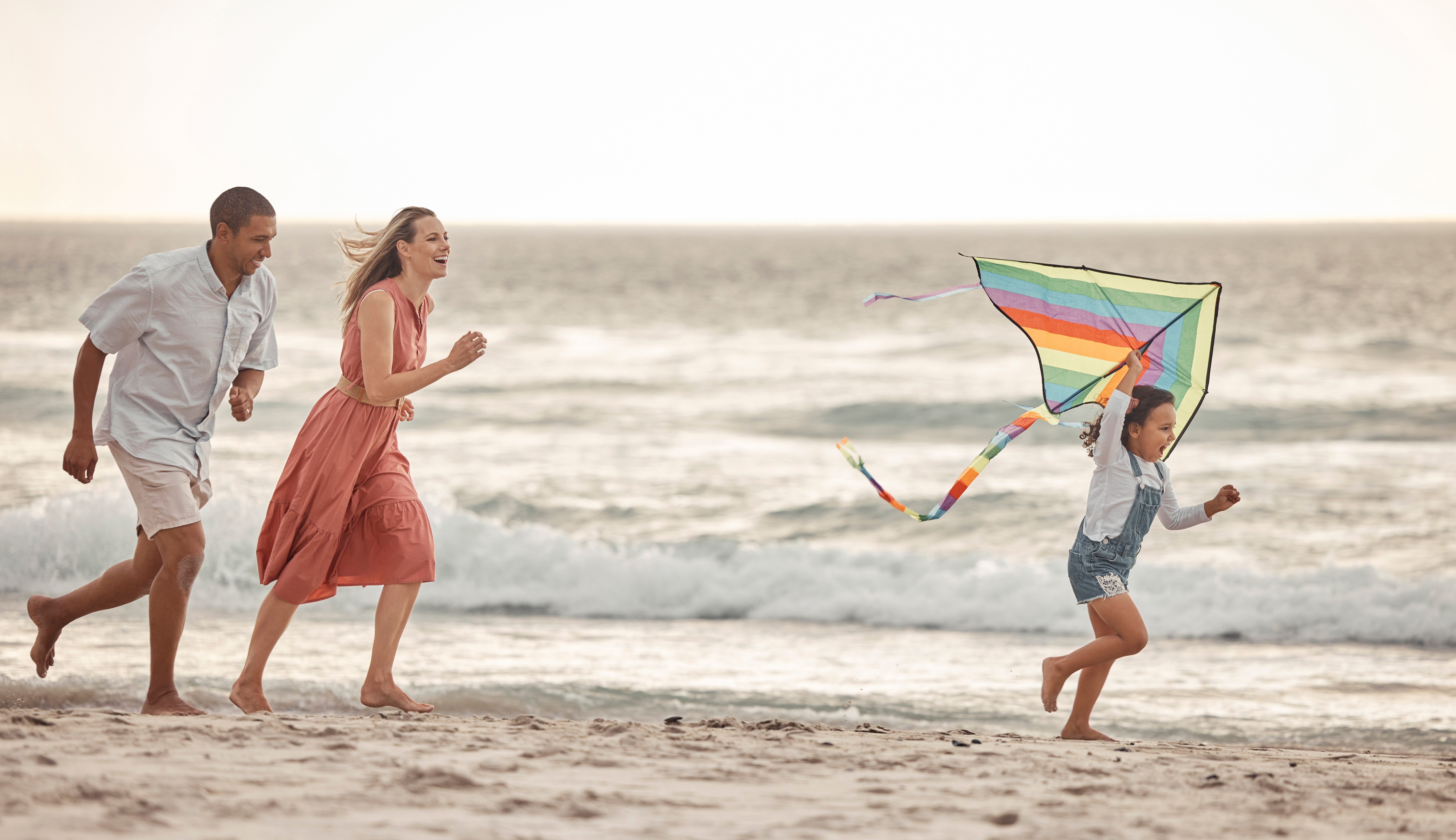 family on the beach enjoying a summer mini vacation