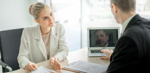 man and woman discussing consolidating debt