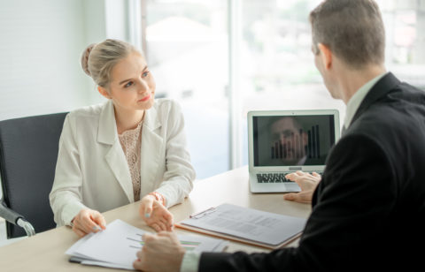 man and woman discussing consolidating debt