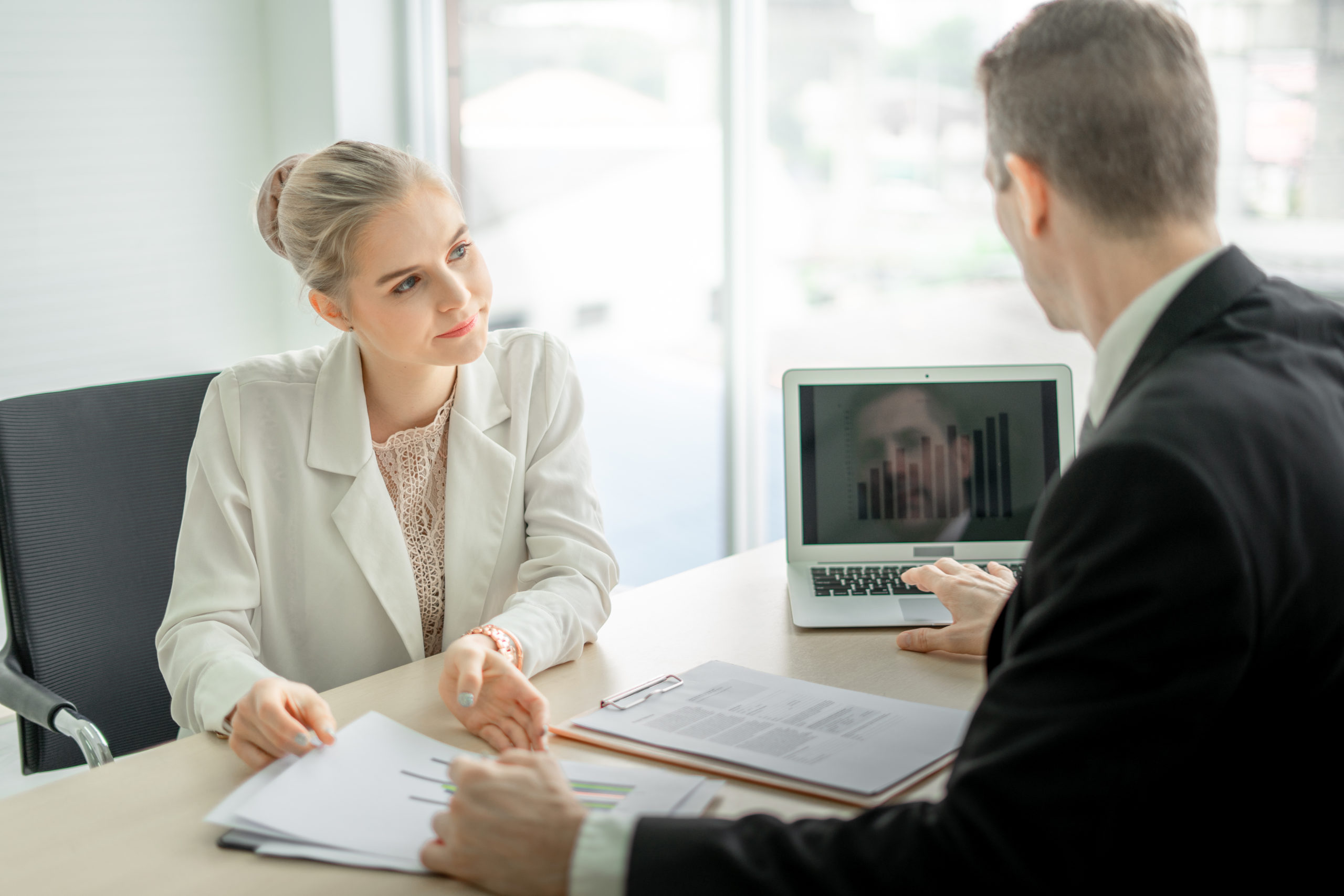 man and woman discussing consolidating debt