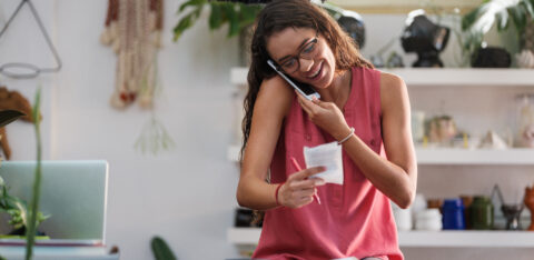 woman consolidating debt on the phone