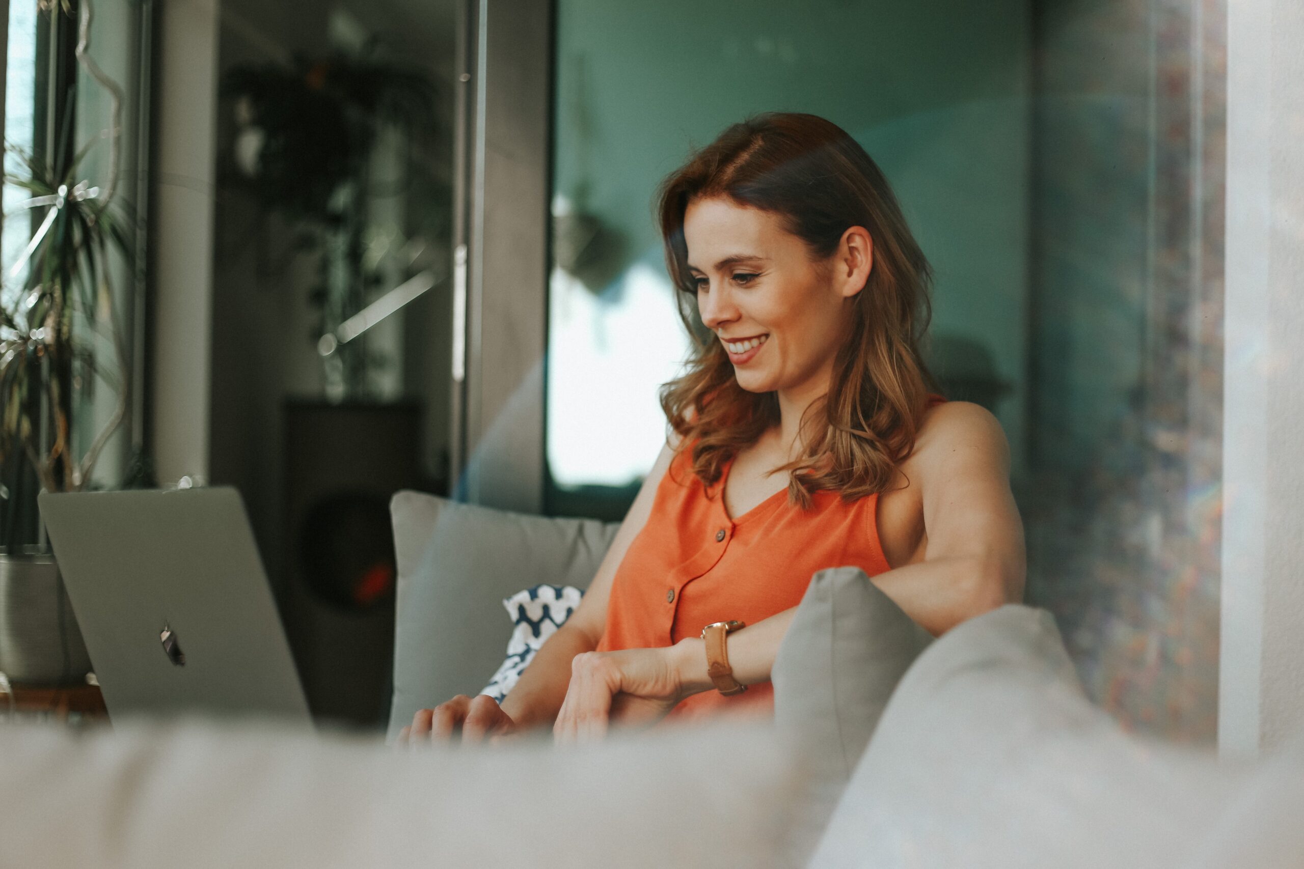 woman smiling at laptop