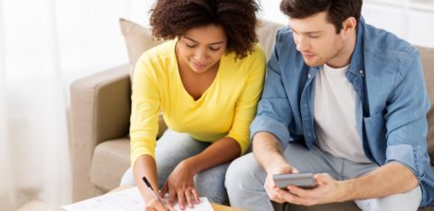 couple signing paperwork