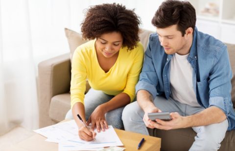 couple signing paperwork