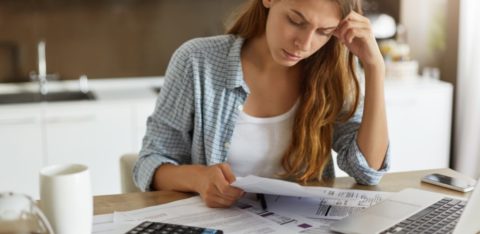 woman reading about credit cards