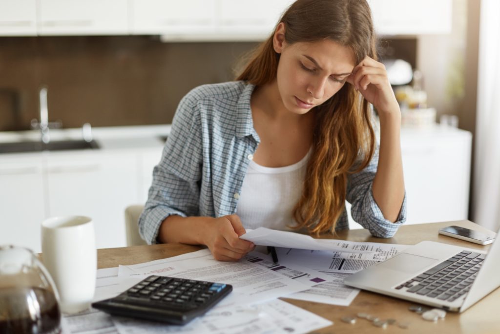 woman reading about credit cards